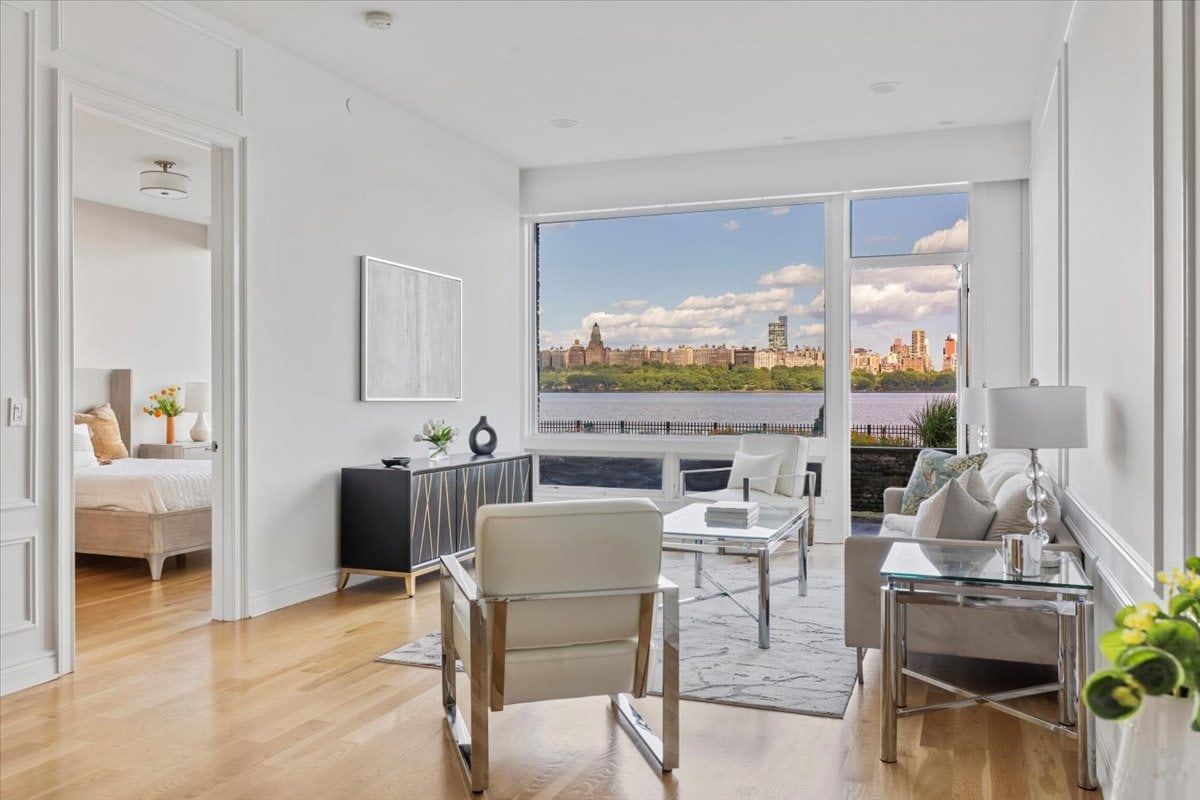 Bright waterfront living room used in listing marketing